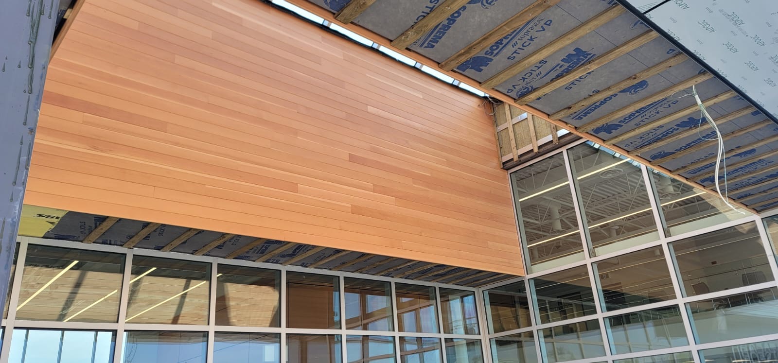 Wide Douglas Fir soffit under the terminal entrance canopy
