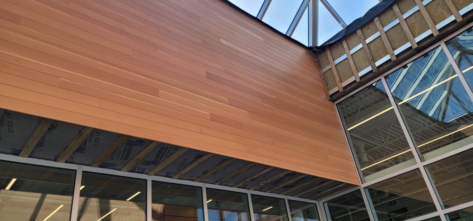 Douglas Fir soffit boards installed beside glazing
