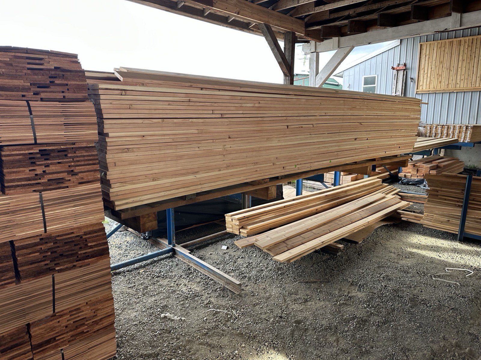 Packs of finished lumber stored under cover at the Sakura plant