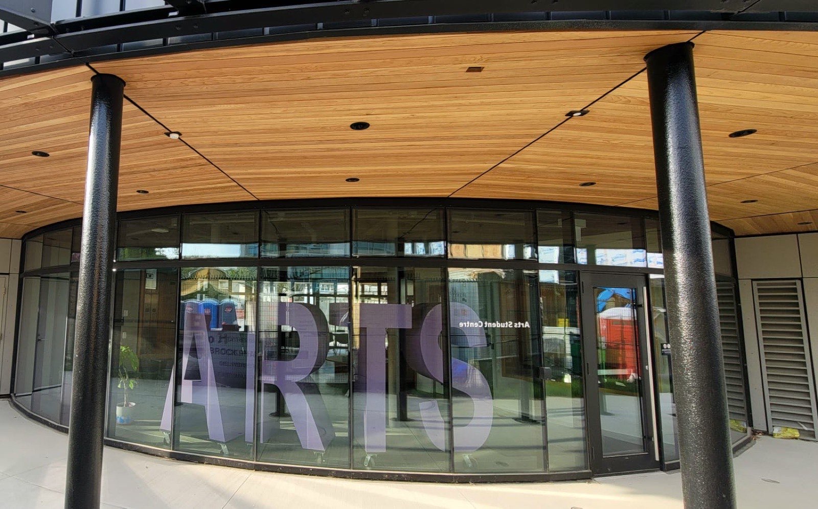 Glass Arts entrance beneath a clear cedar tongue-and-groove ceiling