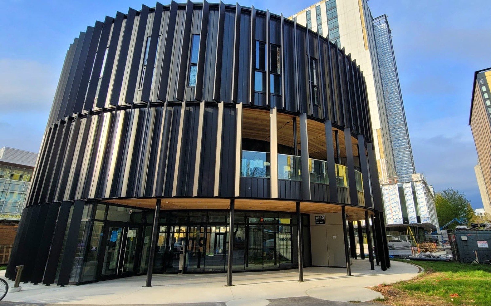 Round Arts Student Centre building at UBC with vertical fins and a wood soffit