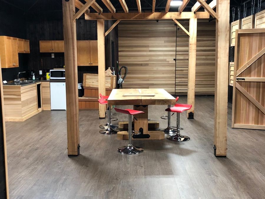 Inside the Weatherwise Home & Garden showroom in Parksville, with cedar-clad walls and a sample table